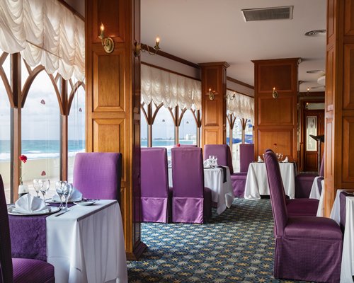 A fine dining outdoor restaurant with an ocean view.