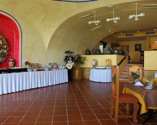 An indoor restaurant with a buffet.