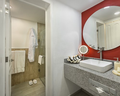 A well furnished bedroom with two beds.