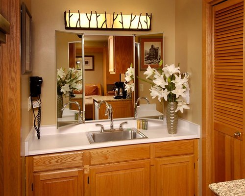 A bathroom with an open sink and vanity.