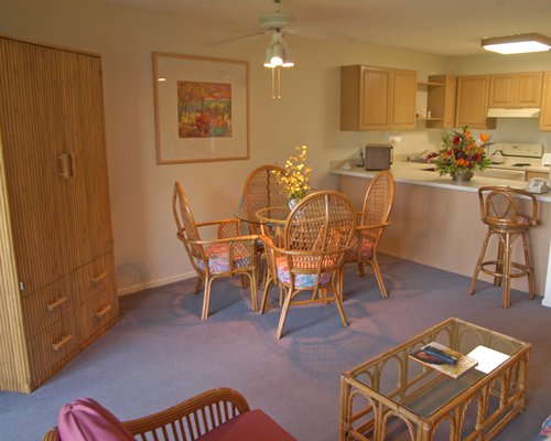An open plan living and dining area alongside a kitchen.
