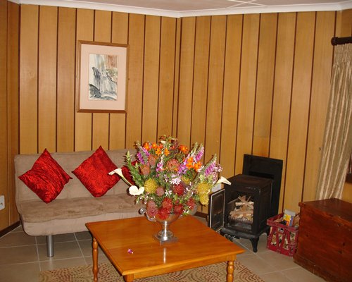 A well furnished living room with a fireplace.