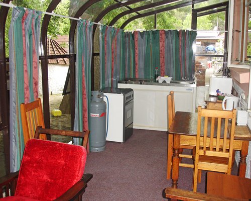 An open plan dining and kitchen area with outside view.