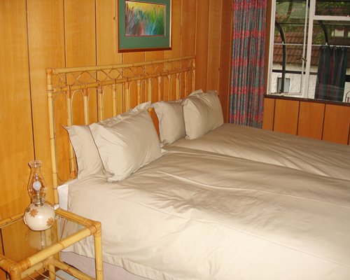 A well furnished bedroom with a double bed.