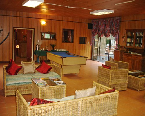 Indoor lounge are recreation room with pool table.