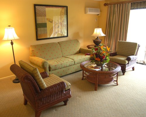 A well furnished living room with a pull out sofa.