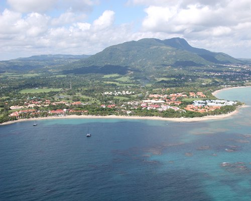 An aerial view of the ocean with buildings and landscaping.