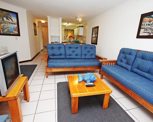A well furnished living room with a television.