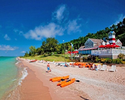 Scenic view of the resort units and chaise lounge chairs facing the beach.