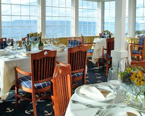 An indoor fine dining restaurant with a lake view.