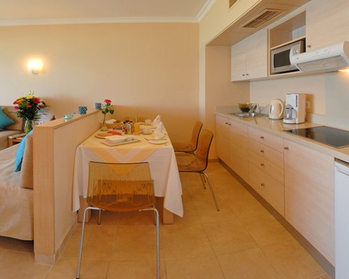 An open plan dining and kitchen area with a microwave.