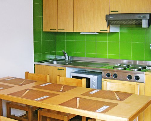 A well equipped kitchen and breakfast bar.