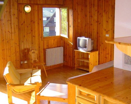 A well furnished living room with a television.