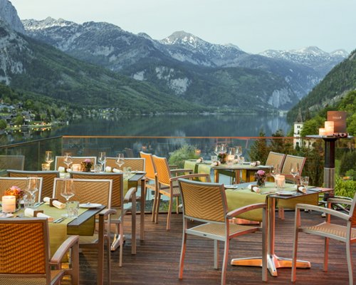 An outdoor dining area in a balcony facing the lake.