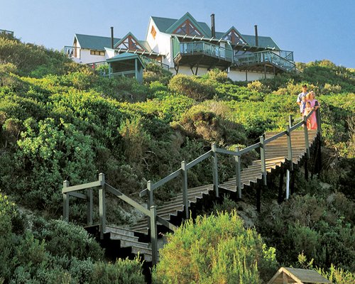 A scenic view of an outdoor staircase alongside resort units.