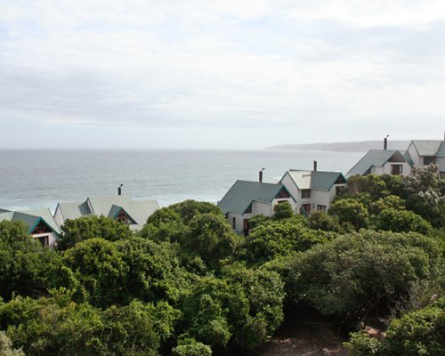 An aerial view of the Wilderness Dunes resort surrounded by woods.