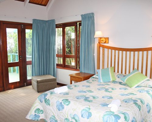 A well furnished bedroom with an outside view.