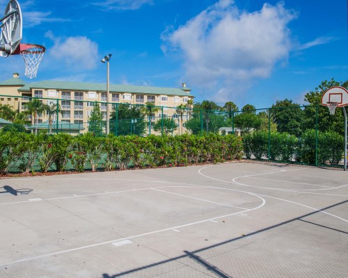 AN OUTDOOR BASKETBALL COURT ALONGSIDE THE RESORT.