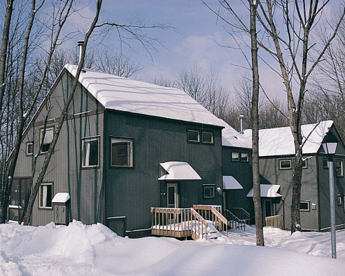 EXTERIOR VIEW OF RIDGE TOP SHAWNEE RESORT COVERED BY SNOW.