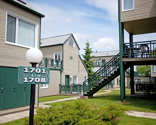 Exterior view of multiple resort units with staircase.