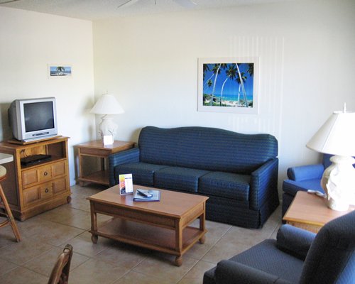 A well furnished living room with a television.