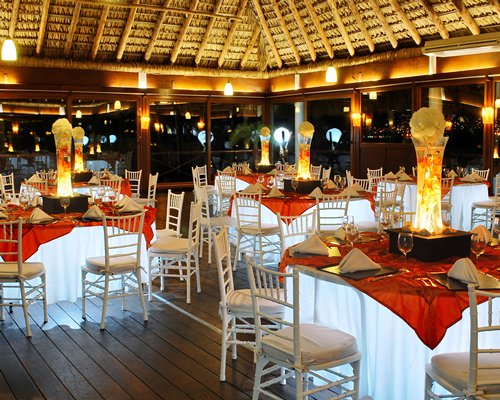 An indoor fine dining area of the Hotel Emporio Acapulco at night.