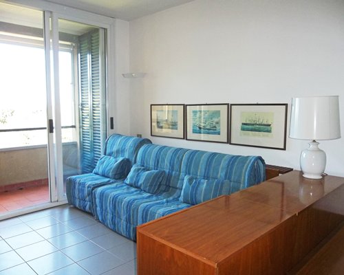 A well furnished living room with balcony.