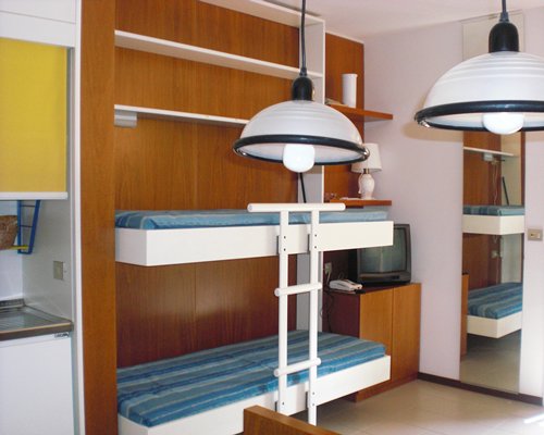 A well furnished bedroom with two bunk beds.