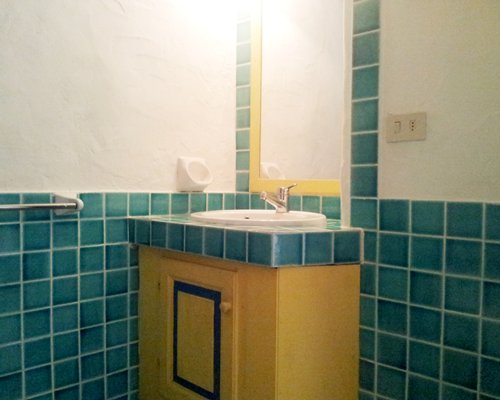 A view of an open single sink vanity.