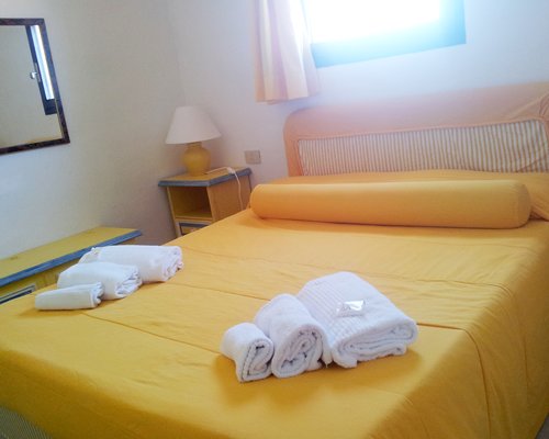 A well furnished bedroom with an outside view.