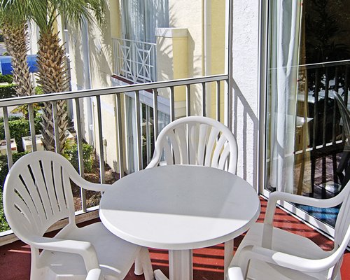 A balcony with patio furniture.