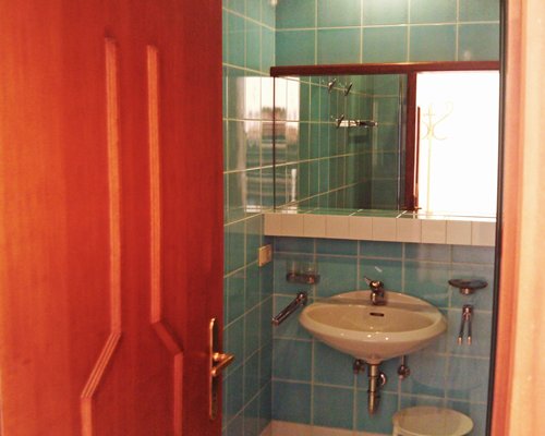 A view of an open single sink vanity.