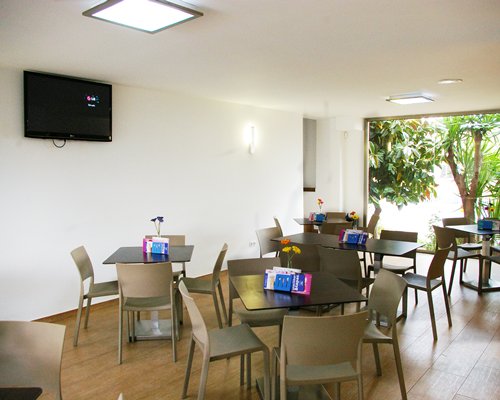 An indoor restaurant with the television.
