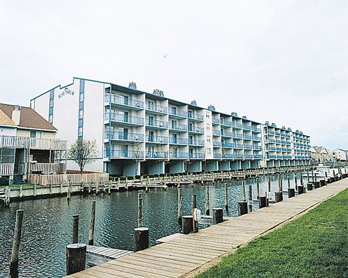 A waterfront with wooden pier alongside the resort.