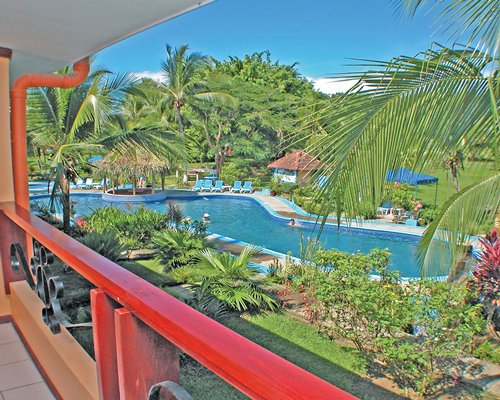 Balcony view of an outdoor swimming pool.