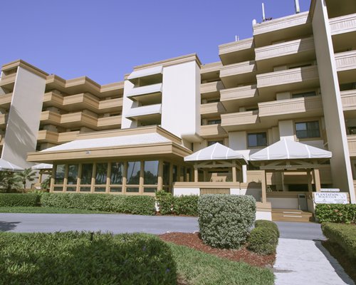 Scenic exterior view of multiple unit balconies with a pathway.