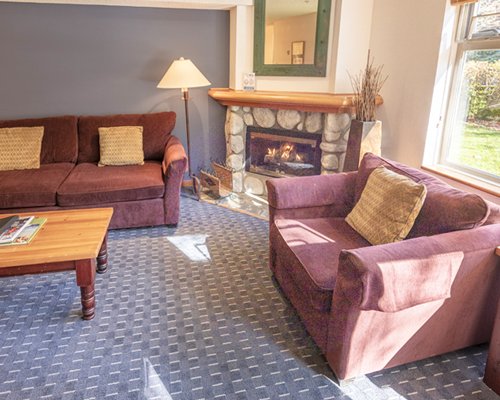A well furnished living room with a fireplace.