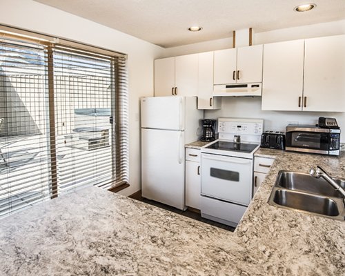 An open plan dining area with kitchen.