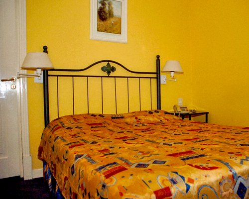 A well furnished bedroom with a king bed.