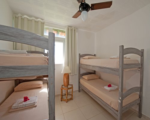 A well furnished bedroom with bunk beds.