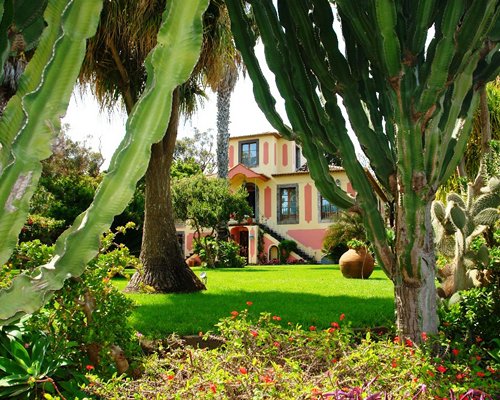 An exterior view with landscaping.
