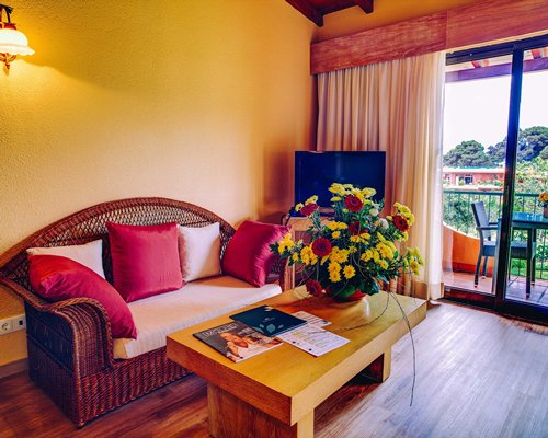 An interior view of living area with balcony view.