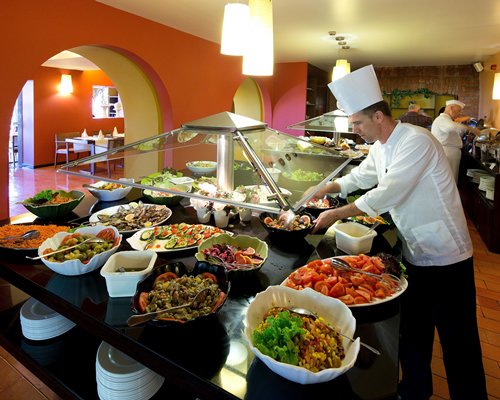 A restaurant buffet being set up.