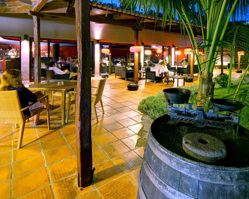 An outdoor lounge area in evening.