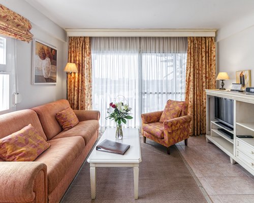 A well furnished living room with a television.
