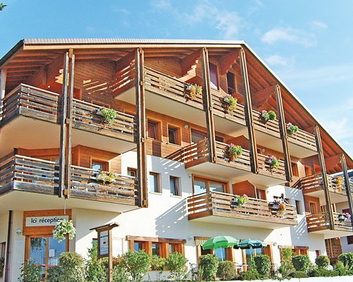 Scenic exterior view of multiple unit balconies.