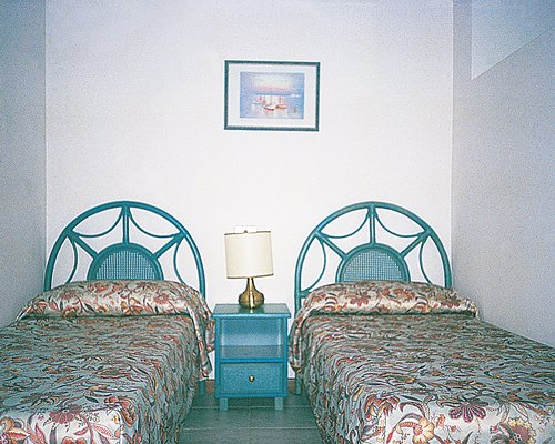 A well furnished bedroom with two beds.