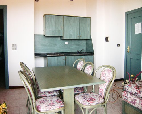 An open plan kitchen with a living room and dining area.