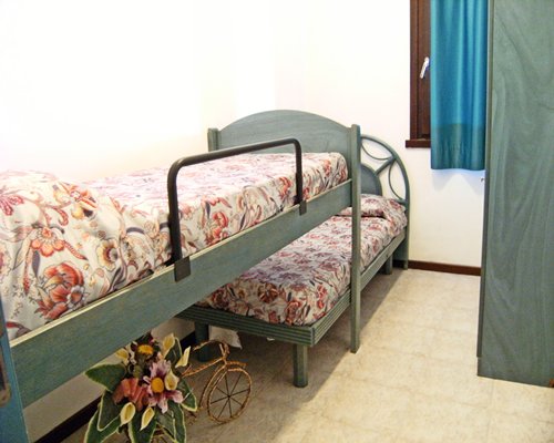 A well furnished bedroom with two bunk beds.