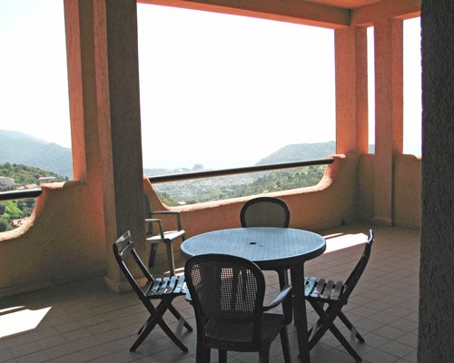 A balcony with patio furniture.